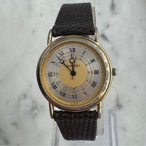 Movado Gold and Black Roman Numeral Watch